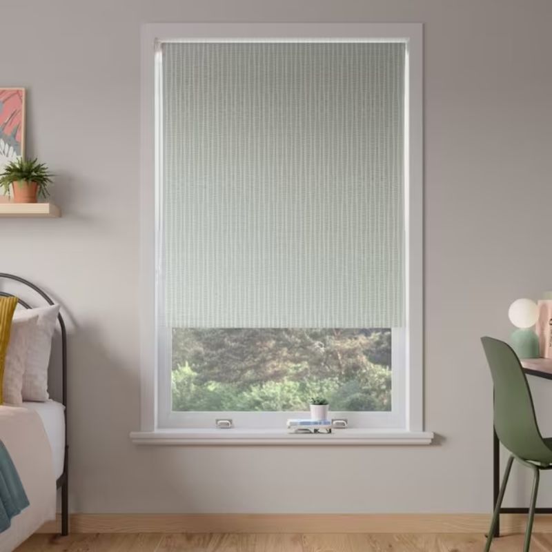 light green patterned roller blind on neutral wall
