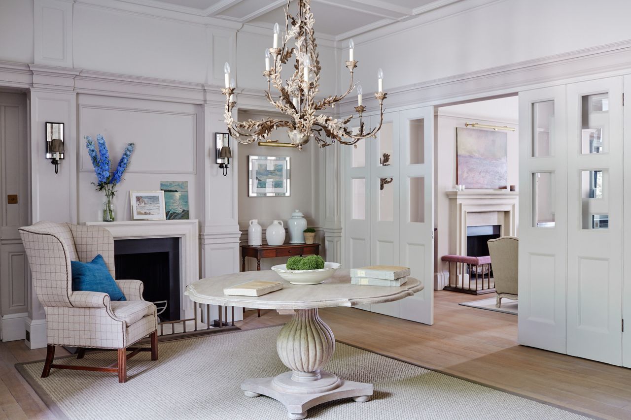 Living room by Sims Hilditch looking towards fireplace with rugs