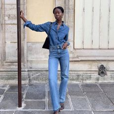 Influencer Sylvie Mus wears Madewell jeans and a denim button-up.
