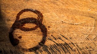 coffee stain rings on a piece of wooden furniture