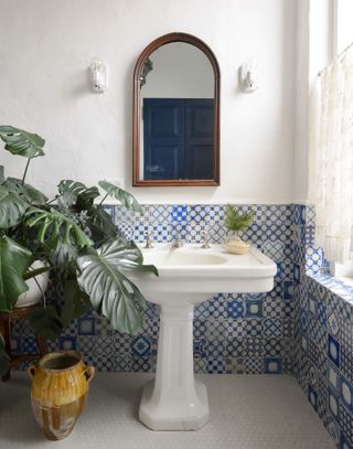 Bathroom tile idea with half blue tiled wall