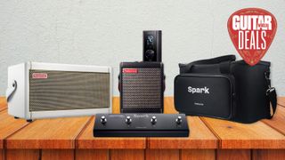 A selection of smart amps, desktop amps, and accessories from Positive Grid on a wooden desk