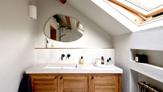 Wooden vanity sink unit with marble top and inbuilt shelves