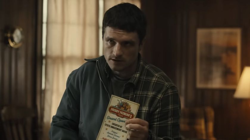 Mike holding a Freddy Fazbear&#039;s Pizzaria pamphlet in Five Nights at Freddy&#039;s 2