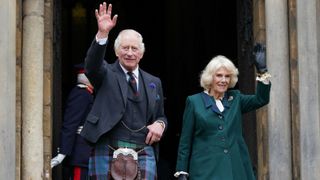 King Charles III and Queen Camilla wave as they leave Dunfermline Abbey