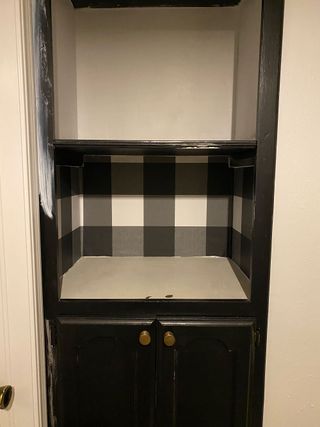 Peel and stick plaid wallpaper in grey to update old built-in hallway cabinet