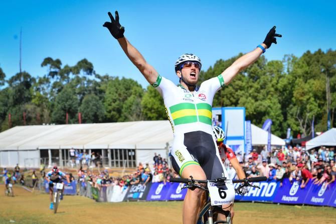 Australian Paul Van der Ploeg celebrates as he came over the line in first place of the men's eliminator