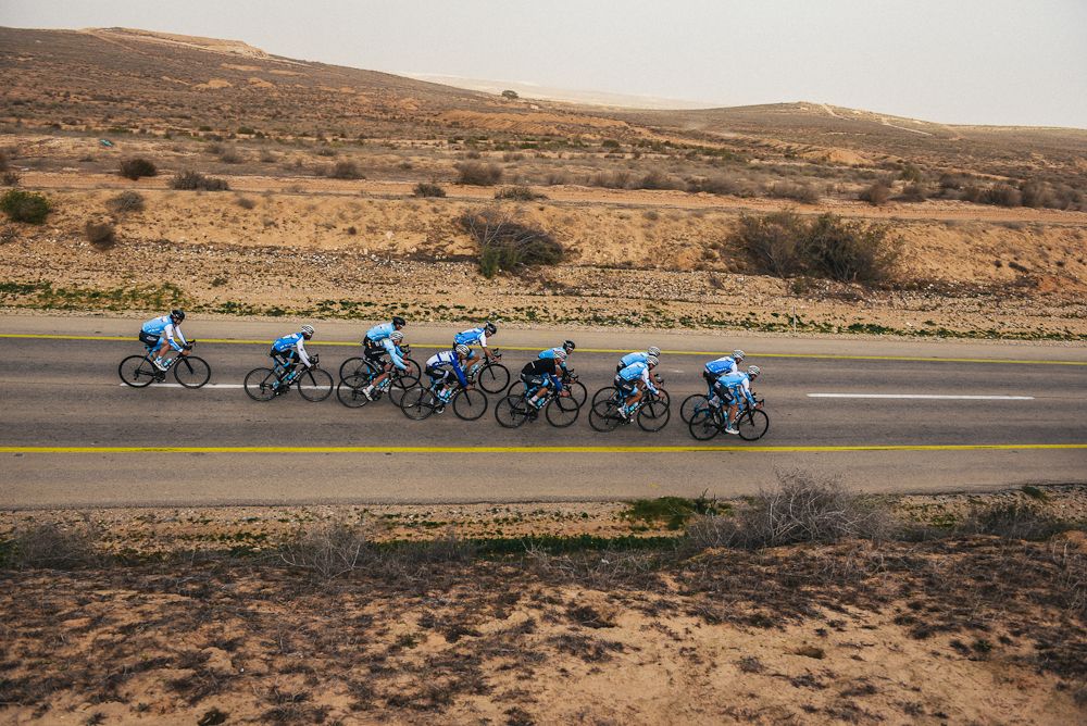 The stark desert landscape surrounds the Israel Cycling Academy riders at team camp