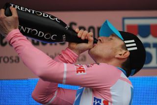 Wiggins celebrates taking the leader’s jersey after winning the time trial on stage one of the 2010 Giro