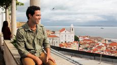 Young man enjoying vista in Lisbon, Portugal
