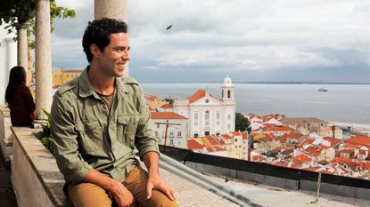 Young man enjoying vista in Lisbon, Portugal