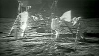 NASA astronauts Neil Armstrong and Buzz Aldrin assemble the American flag on the moon during their Apollo 11 lunar landing mission in July 1969. NASA astronauts on the International Space Station marked the 45th anniversary of the Apollo 11 launch with a video message on July 16.