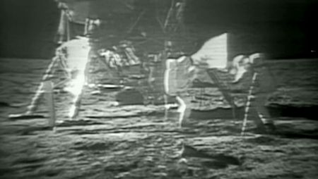 NASA astronauts Neil Armstrong and Buzz Aldrin assemble the American flag on the moon during their Apollo 11 lunar landing mission in July 1969. NASA astronauts on the International Space Station marked the 45th anniversary of the Apollo 11 launch with a video message on July 16.