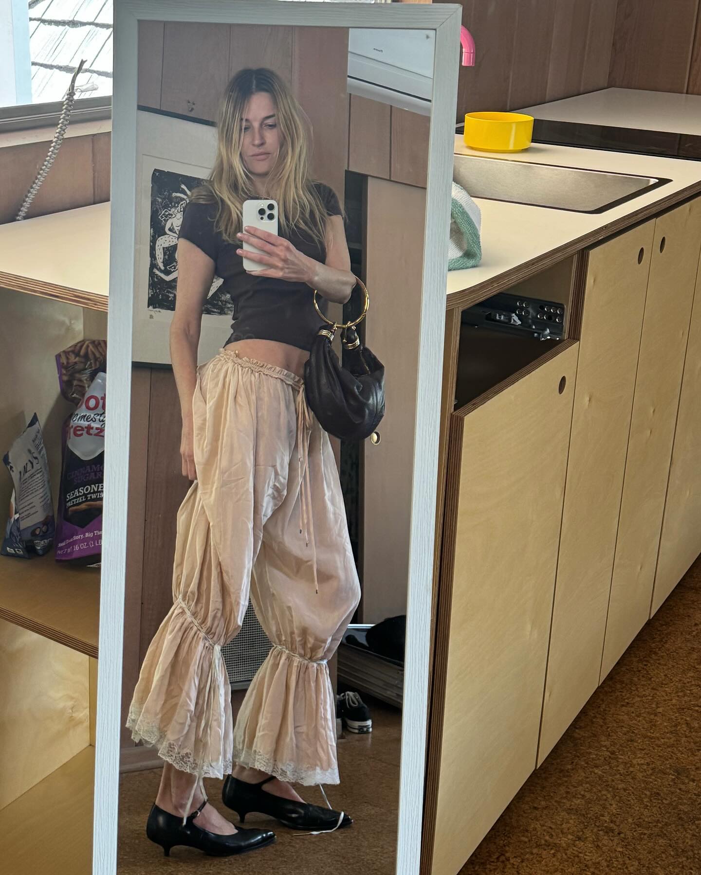 An image of @camillecharriere wearing a summer trouser trend.