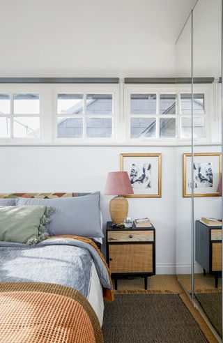 a bedroom with a high transom window