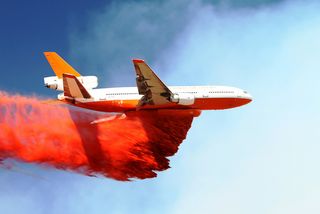 The DC-10 Very Large Air Tanker (VLAT) drops fire retardant near Greer, AZ. If a pyrocumulus develops, the planes are grounded. Photo by Jayson Coil.