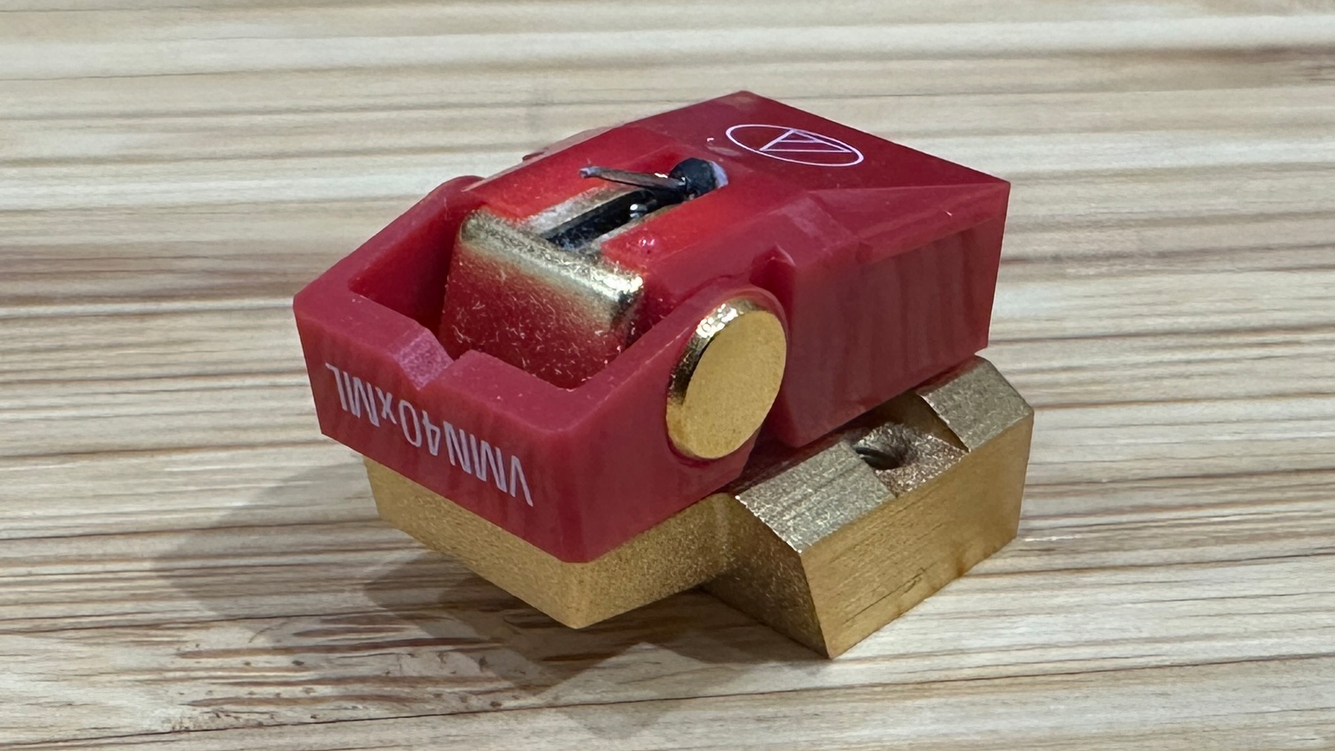 Audio-Technica AT-VM740xML moving magnet cartridge upside down on wooden surface