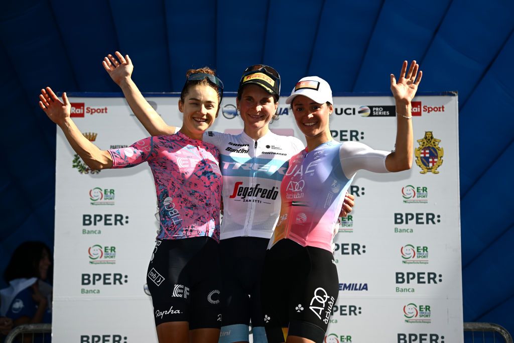 SAN LUCA ITALY OCTOBER 01 LR Veronica Ewers of United States and Team EF Education Tibco Svb on second place race winner Elisa Longo Borghini of Italy and Team Trek Segafredo and Sofia Bertizzolo of Italy and UAE Team ADQ on third place pose on the podium ceremony after the 9th Giro dellEmilia Internazionale Donne Elite 2022 a 897km one day race from Carpi to San Luca 267m on October 01 2022 in San Luca Italy Photo by Dario BelingheriGetty Images