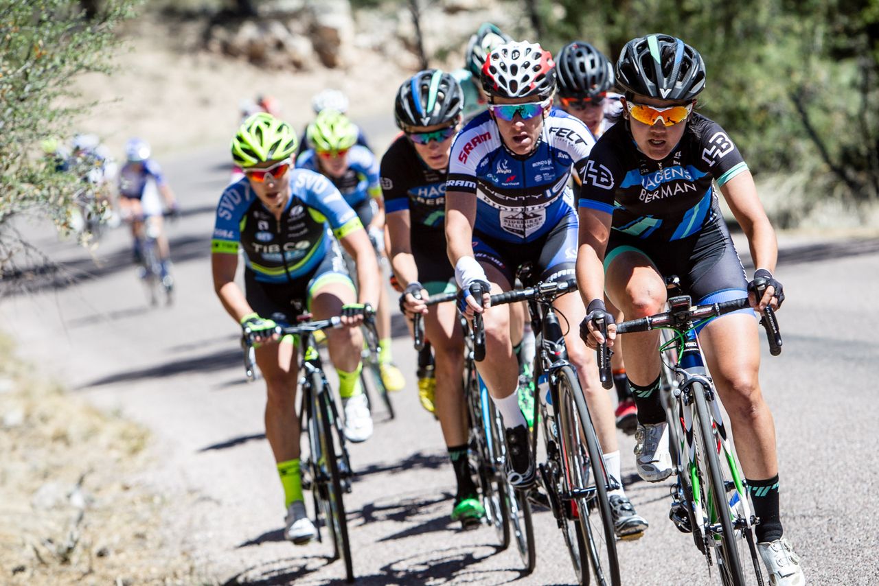 A chase group forms as the race leader goes up the road