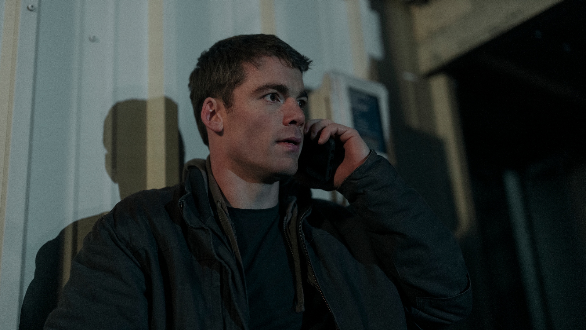 Peter talks on the phone in The Night Agent