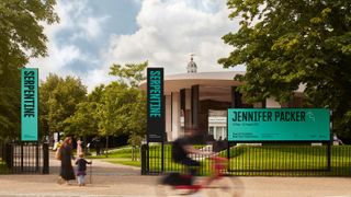 Hingston Studio's visual identity for Serpentine Galleries, as seen on banners in front of the Serpentine Pavilion 2021 by Counterspace
