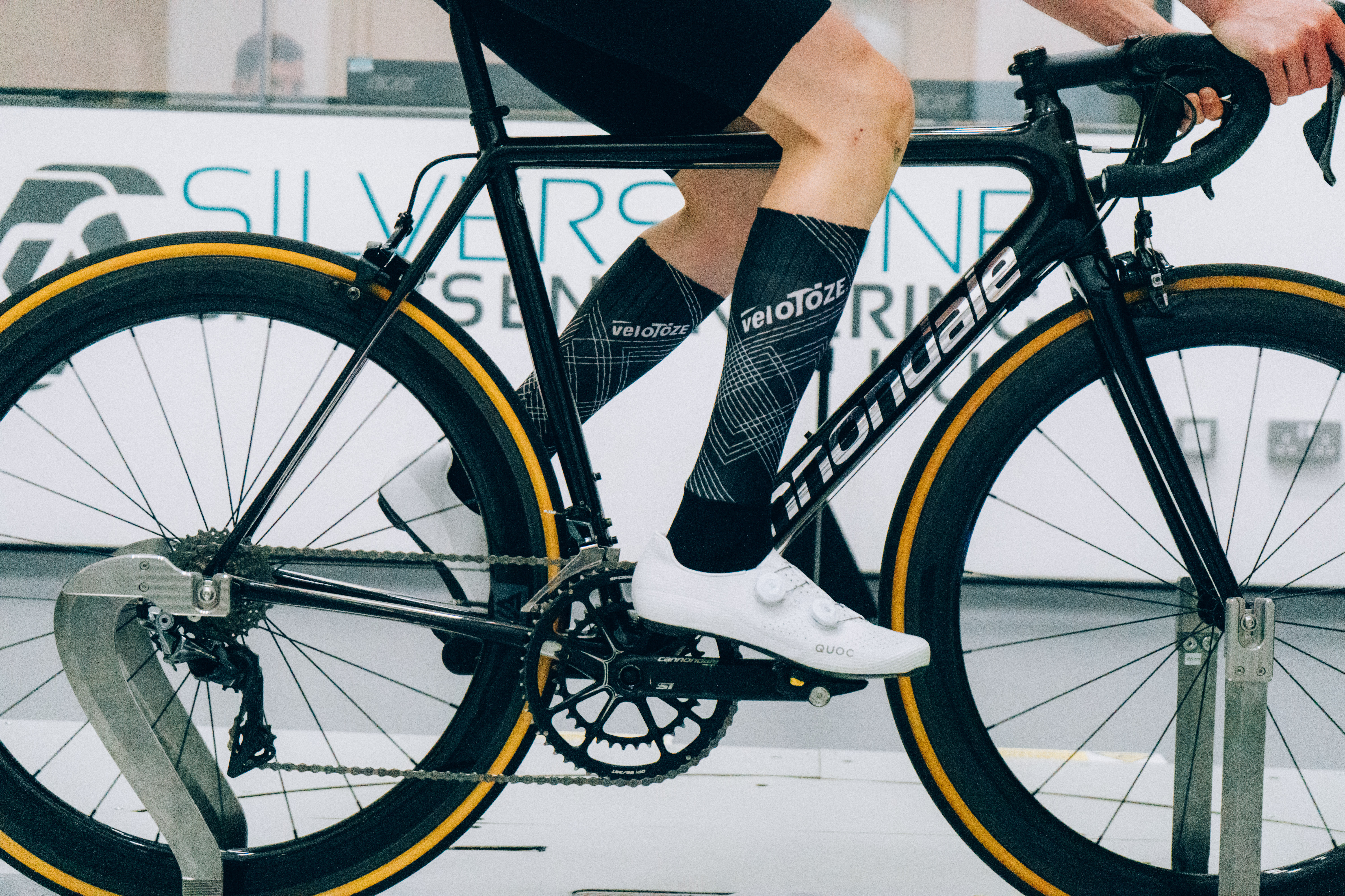A close up of the socks that Tom is wearing while riding a bike in the wind tunnel