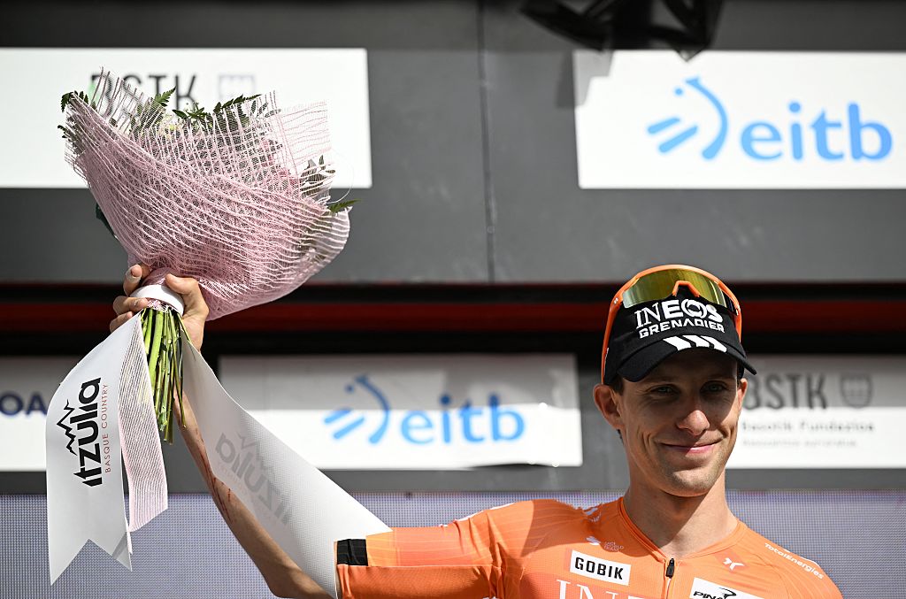 Team Ineos' French rider Axel Laurance celebrates on the podium winning the third stage ahead of Team UAE's Spanish rider Igor Arrieta during the Basque Country's Itzulia cycling tour, a 152.8 km race starting and finishing in Basauri, on April 8, 2026. (Photo by ANDER GILLENEA / AFP)