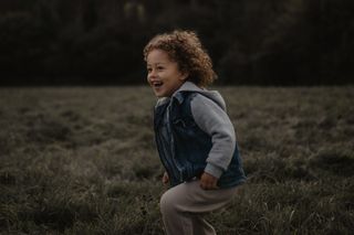 Boy running in field