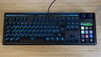 Corsair Galleon 100 SD gaming keyboard on a wooden desk