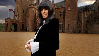 Claudia Winkleman outside The Traitors castle