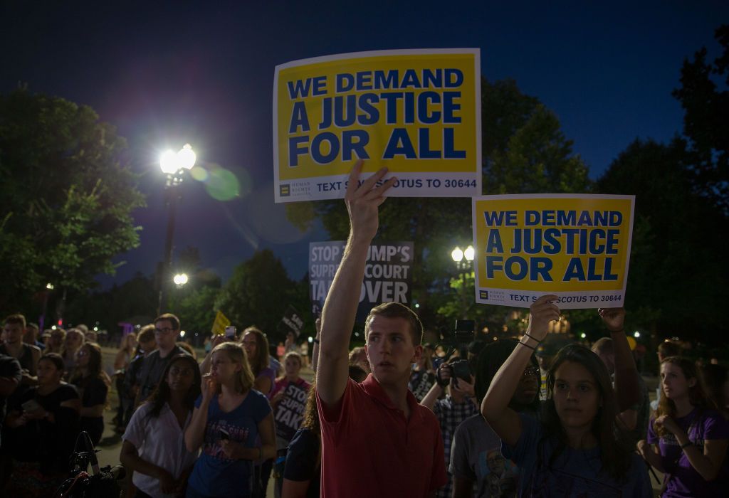 Protesters outside the Supreme Court on Monday night.