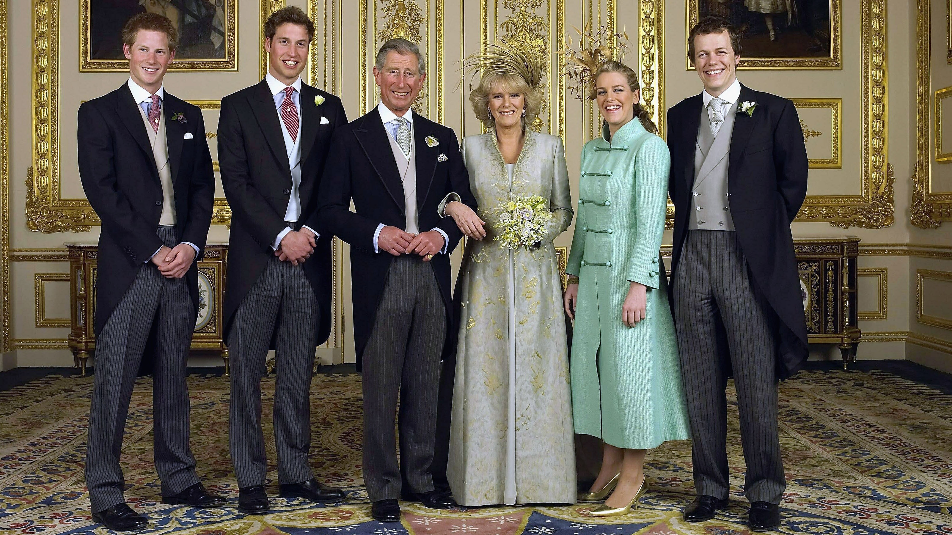 King Charles and Queen Camilla pose with their children (L-R) Prince Harry, Prince William, Laura and Tom Parker Bowles, in the white drawing room for the Official Wedding group photo on April 9, 2005