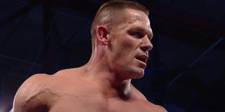 John cena looking at a wrestler WWE