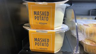 A close up of fresh mash from Amazon in pots on the shelf of a refrigerator in the shop