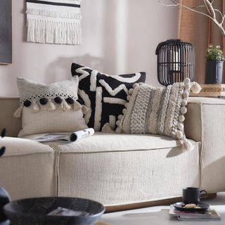 living room with sofa and textured cushions