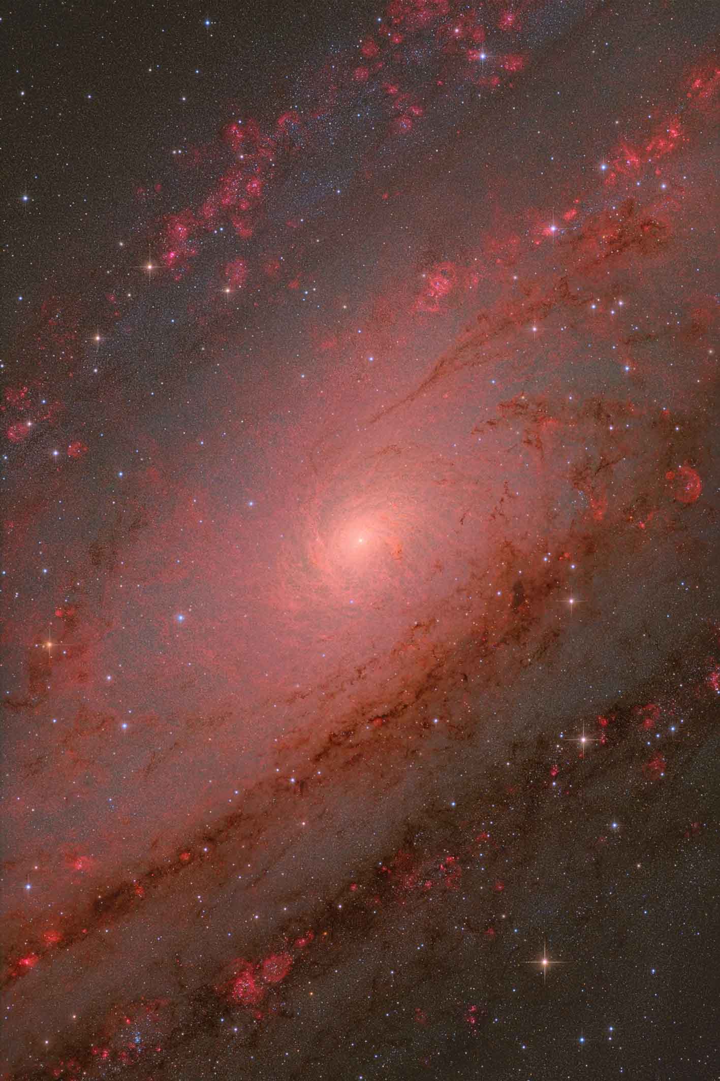 Glowing spiral galaxy with vibrant pink and red hues, featuring swirling gas clouds and sparkling stars. Aesthetic and awe-inspiring cosmic scene