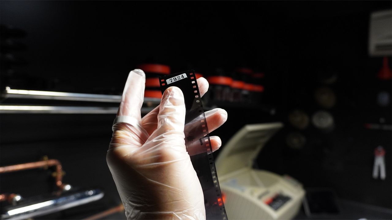 Disposable film camera being processed.