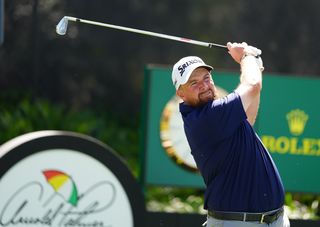 Shane Lowry watches an iron off the tee