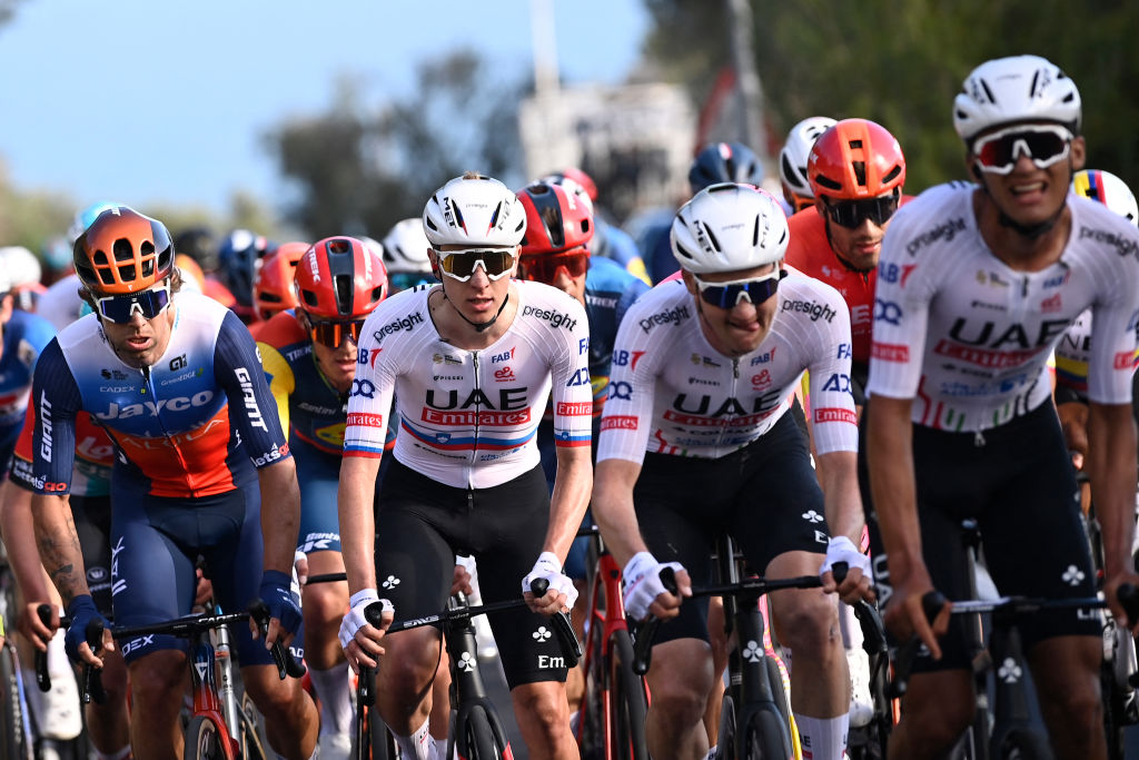 UAE Team Emirates' Slovenian rider Tadej Pogacar (C) rides through the Cipressa during the 115th Milan-SanRemo one-day classic cycling race, between Pavia and SanRemo, on March 16, 2024. (Photo by Fabio FERRARI / POOL / AFP)