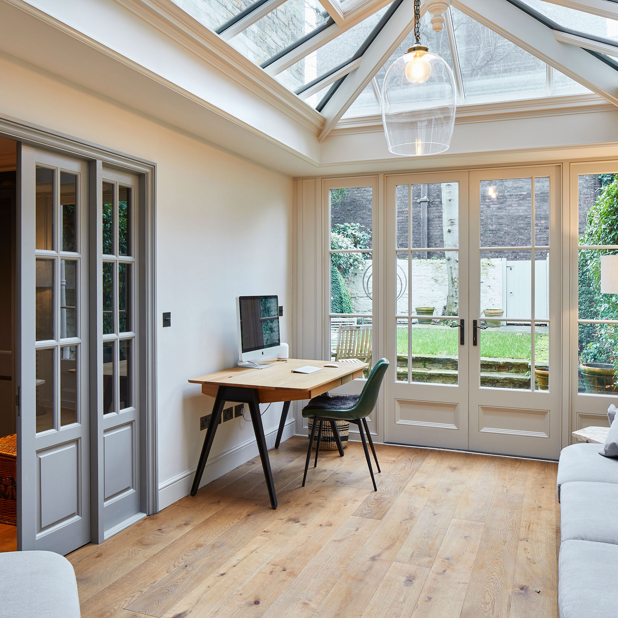 conservatory home office with sliding doors to house and French doors to garden