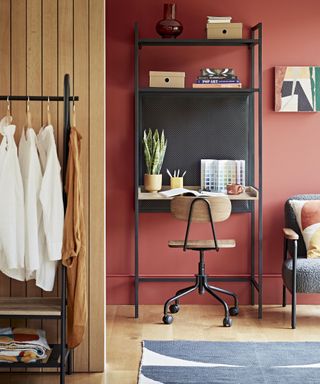 Home office idea by Habitat with red wall paint and black desk