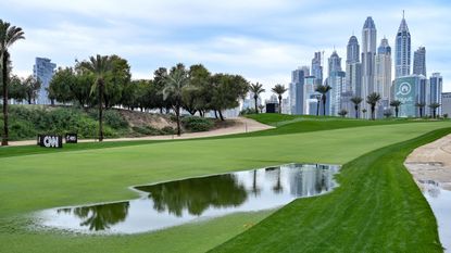 A flooded fairway seen with the Dubai skyline in view