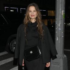 Katie Holmes attends a party for 11 Julliet bags with a leather handbag