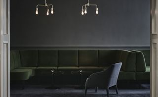 Bar with statement lights and sofa seating