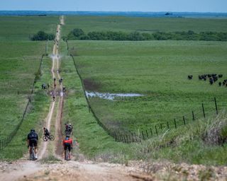 Riders on Unbound Gravel 200 route encounter long stretches of double-track dirt roads and sections of mud