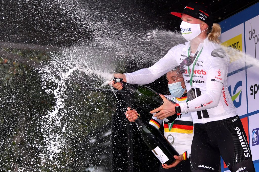 DE PANNE BELGIUM OCTOBER 20 Podium Lisa Brennauer of Germany and Ceratizit Wnt Pro Cycling Team Lorena Wiebes of The Netherlands and Team Sunweb Celebration Champagne Mask Covid safety measures during the 3rd Driedaagse Brugge De Panne 2020 Women Classic a 1563km race from Brugge to De Panne AG3daagse on October 20 2020 in De Panne Belgium Photo by Luc ClaessenGetty Images