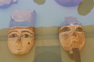 Numerous artifacts were found in the cemetery, including wooden and ceramic masks.