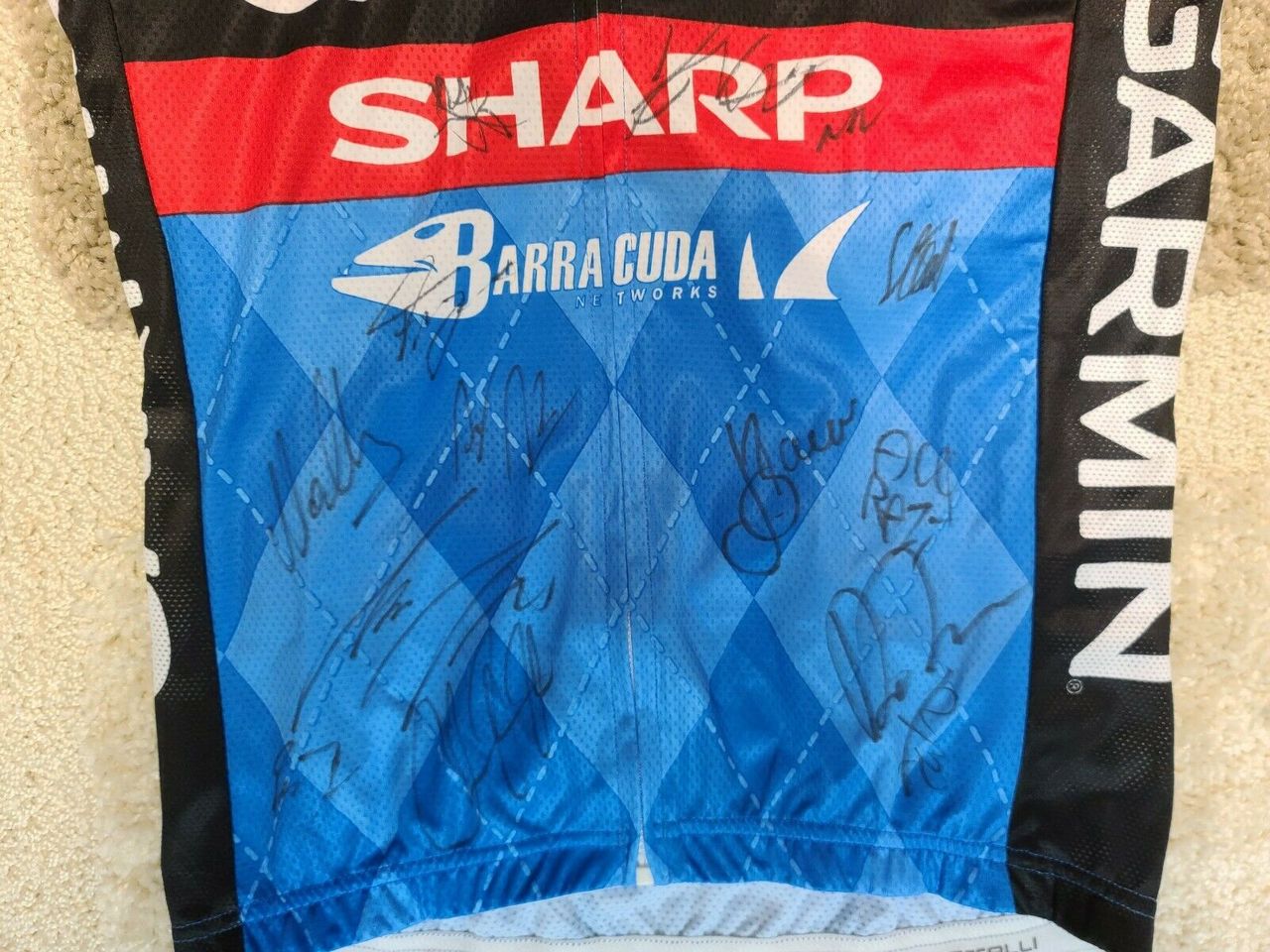 A number of riders from the team, including Dan Martin, Jack Bauer and Dave Zabriskie, have signed the front of the jersey