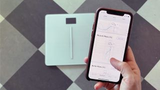The Withings Body Cardio smart scale pictured with a smartphone