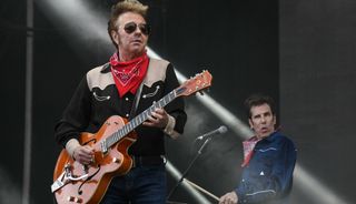 The Stray Cats' Brian Setzer (left) and Slim Jim Phantom perform onstage in Belfort, France on July 7, 2019